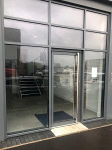 Custom glass shopfront and door with bar pull handle