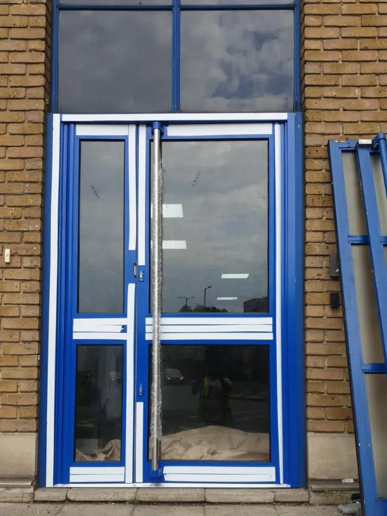 Glass and Aluminium entrance door with side pannel and full lenght bar pull handle