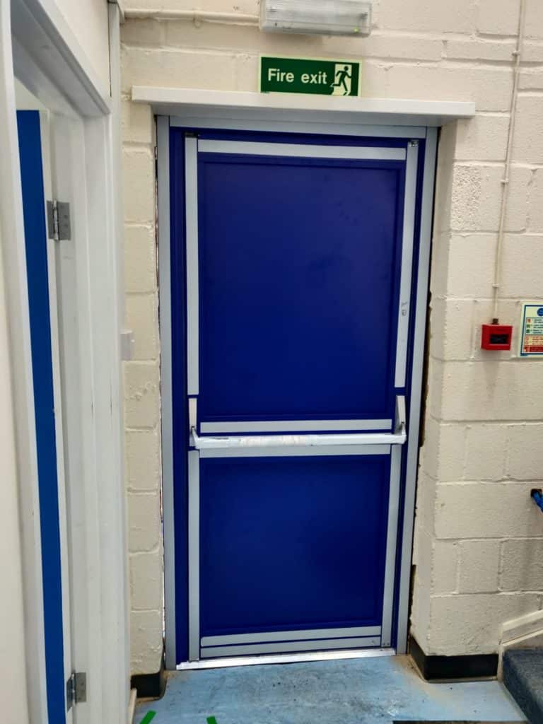 Blue aluminium fire exit door with push bar